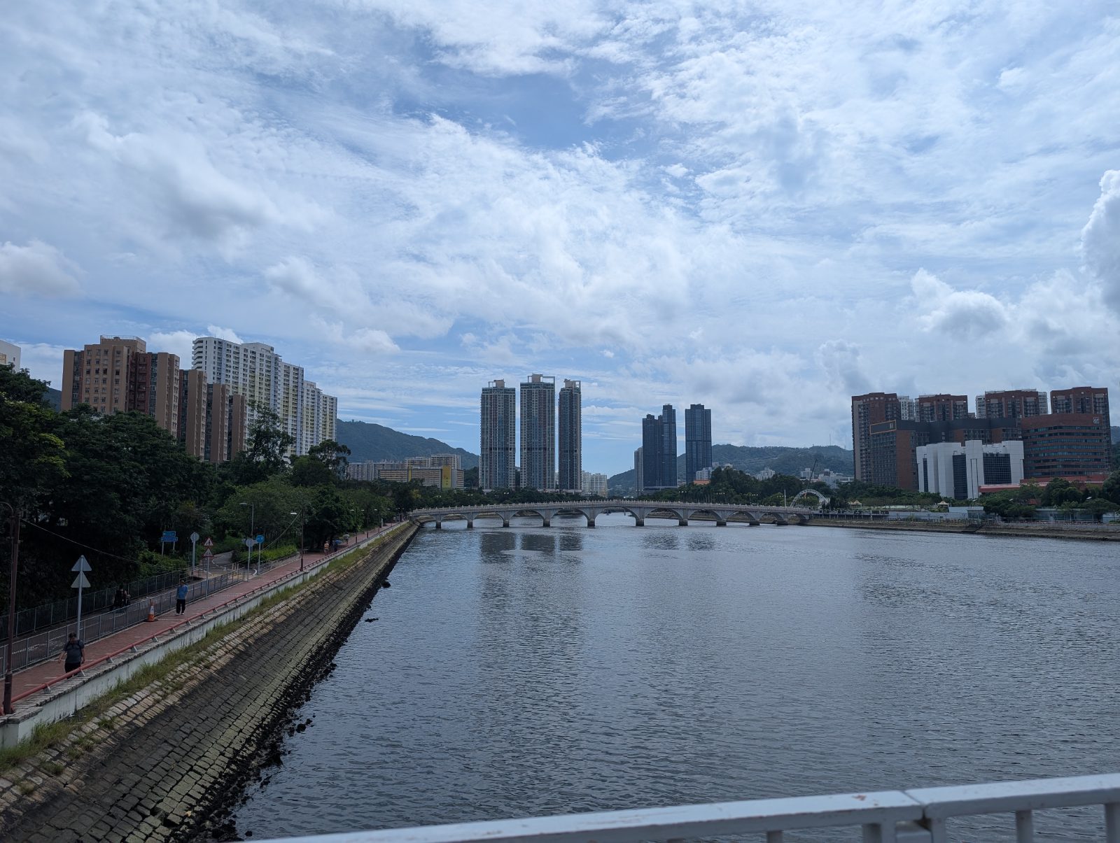 Skyscrapers always visible, but mountains surround