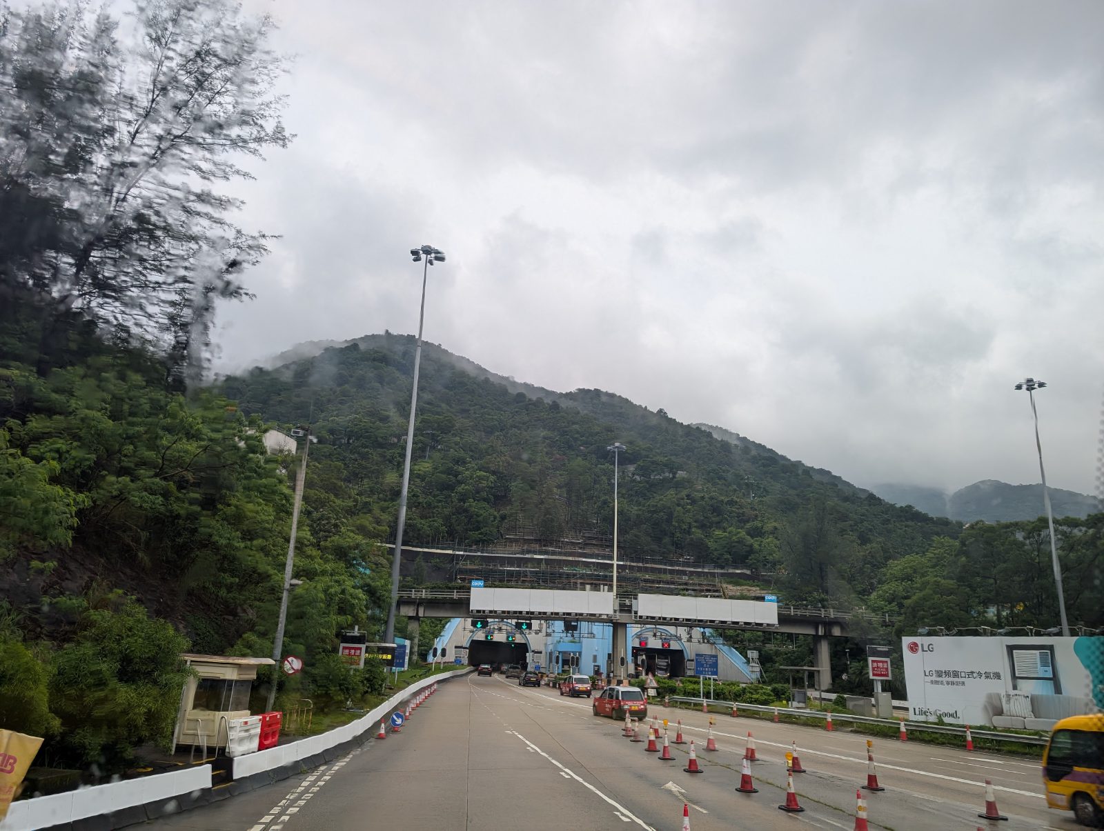 Lush greenery with the road and tunnel feeling a little worse for wear